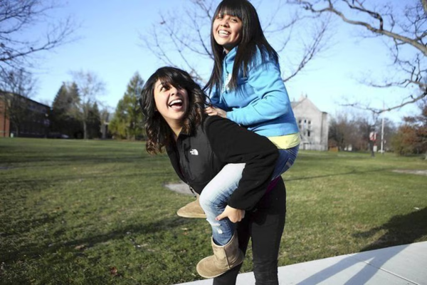 Leticia Gelacio, 19, left, and her sister, Jasmine, 18, are students at Lake Forest College. The graduates of Hancock High School, on the Southwest Side of Chicago, received assistance from the Network for College Success, a partnership between the University of Chicago and Chicago Public Schools. (Michael Tercha, Chicago Tribune)