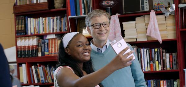 Semaj, a 9th Grade Student at North-Grand, takes a selfie with Bill Gates